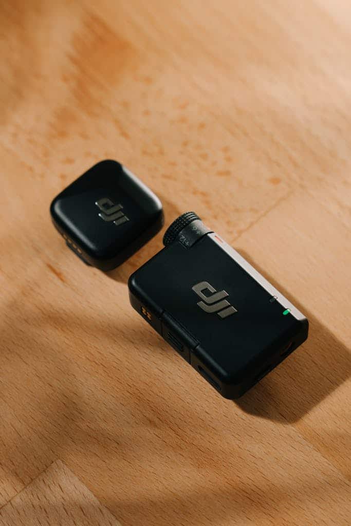 Wireless microphone system with receiver on wooden surface with soft lighting.